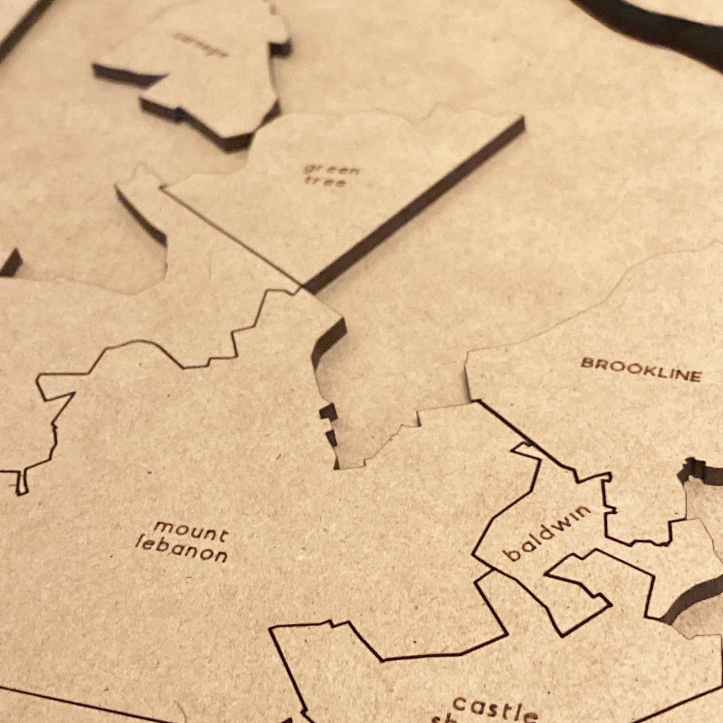Close up of the pieces of the Pittsburgh Neighborhoods & Boroughs Puzzle Map
