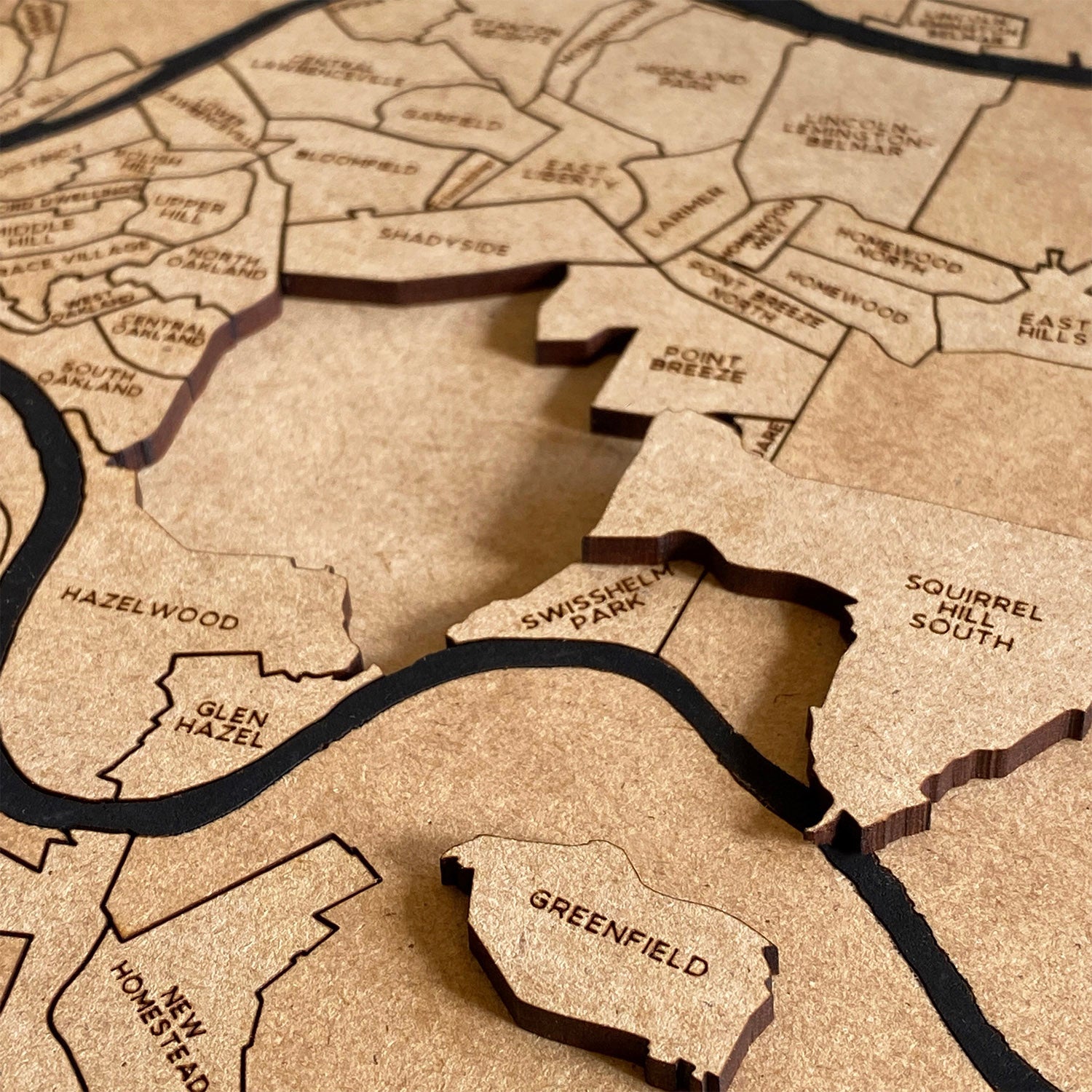 Close up of Pittsburgh Neighborhoods Puzzle Map pieces
